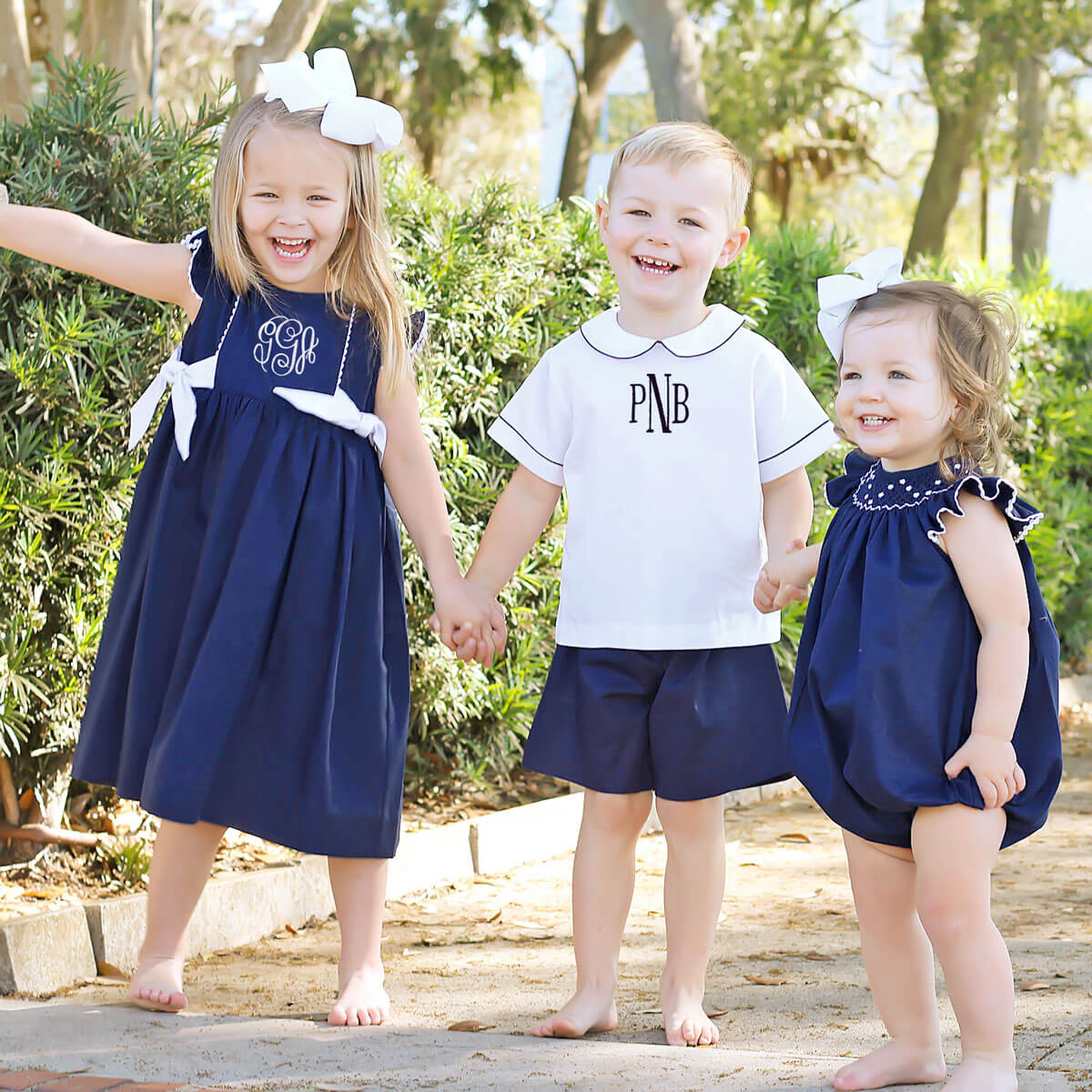 White Geometric Vine Smocked Bubble Navy Pique