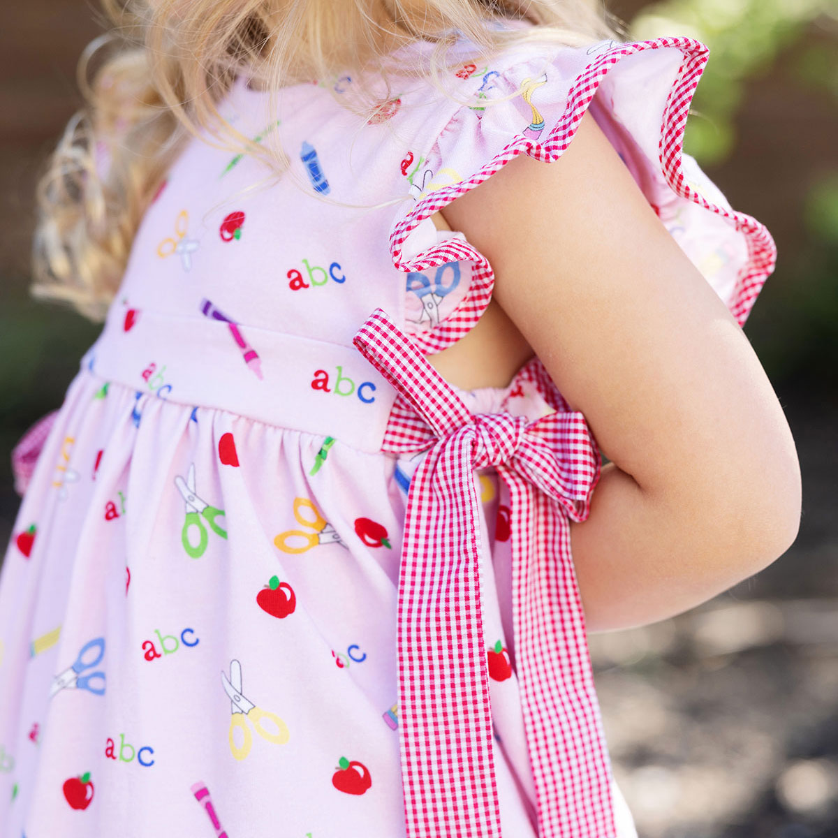 Apple Pencil ABC Crayon And Scissor Pink Print Side Tie Dress Classic Apple pencil abc crayon and scissor pink print side tie dress classic